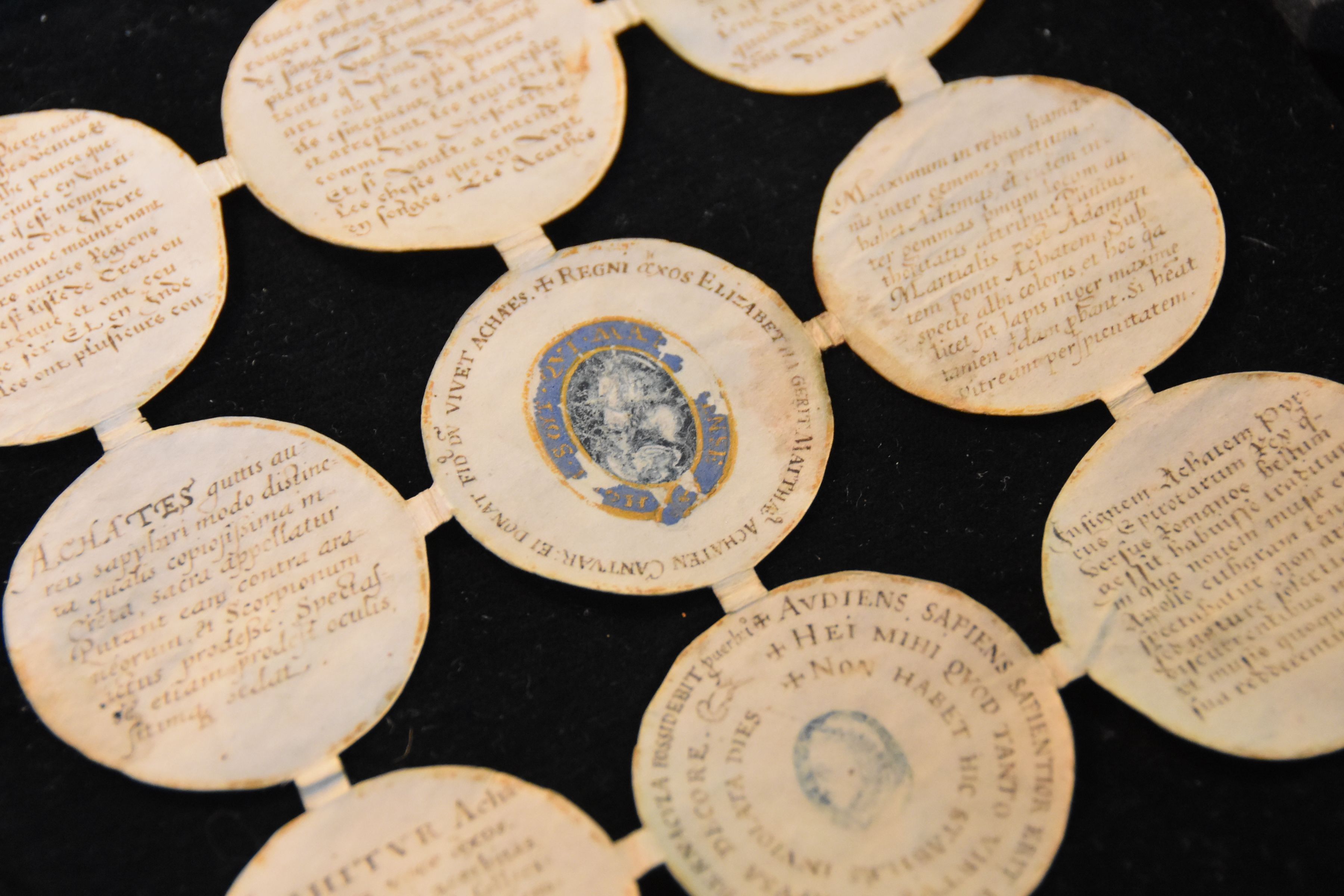 The roundel manuscript is on parchment and has nine sections