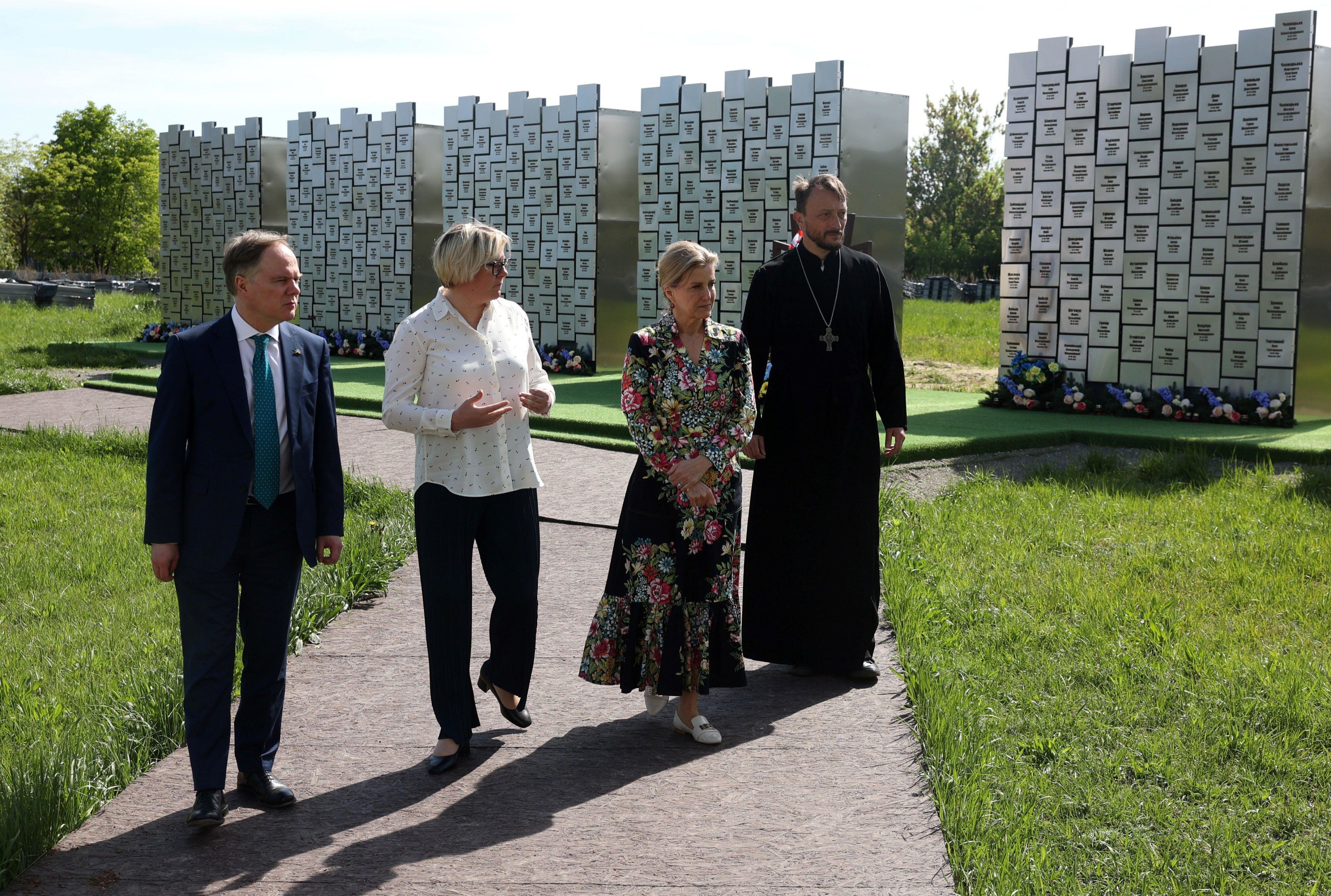 Martin Harris (left) with the Duchess of Edinburgh with the Ambassador of the United Kingdom at the memorial to the victims of the Russian occupation in Bucha in April 2024.