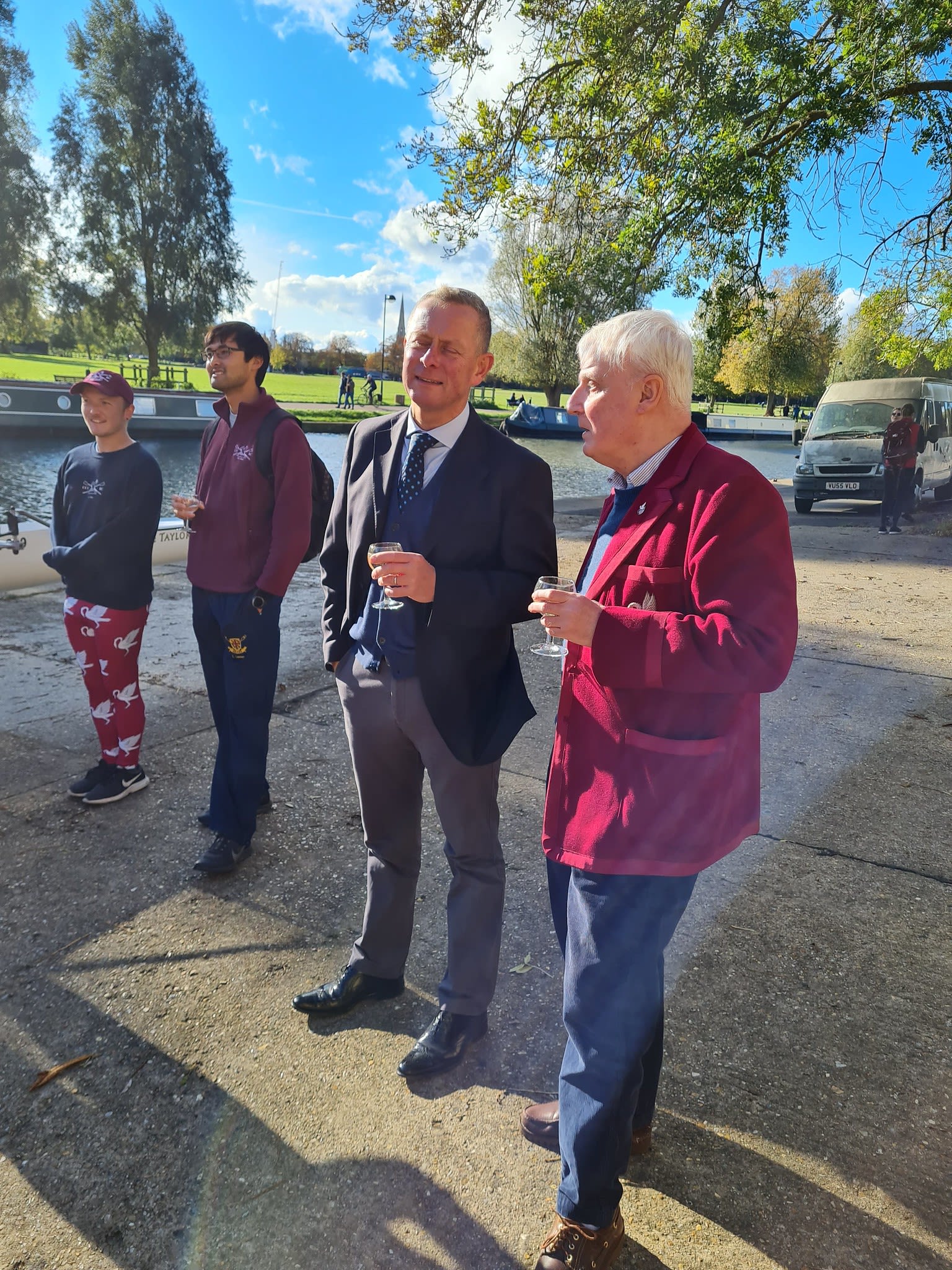 Peter, wearing his boat club blazer, chatting with Boatman Tim.