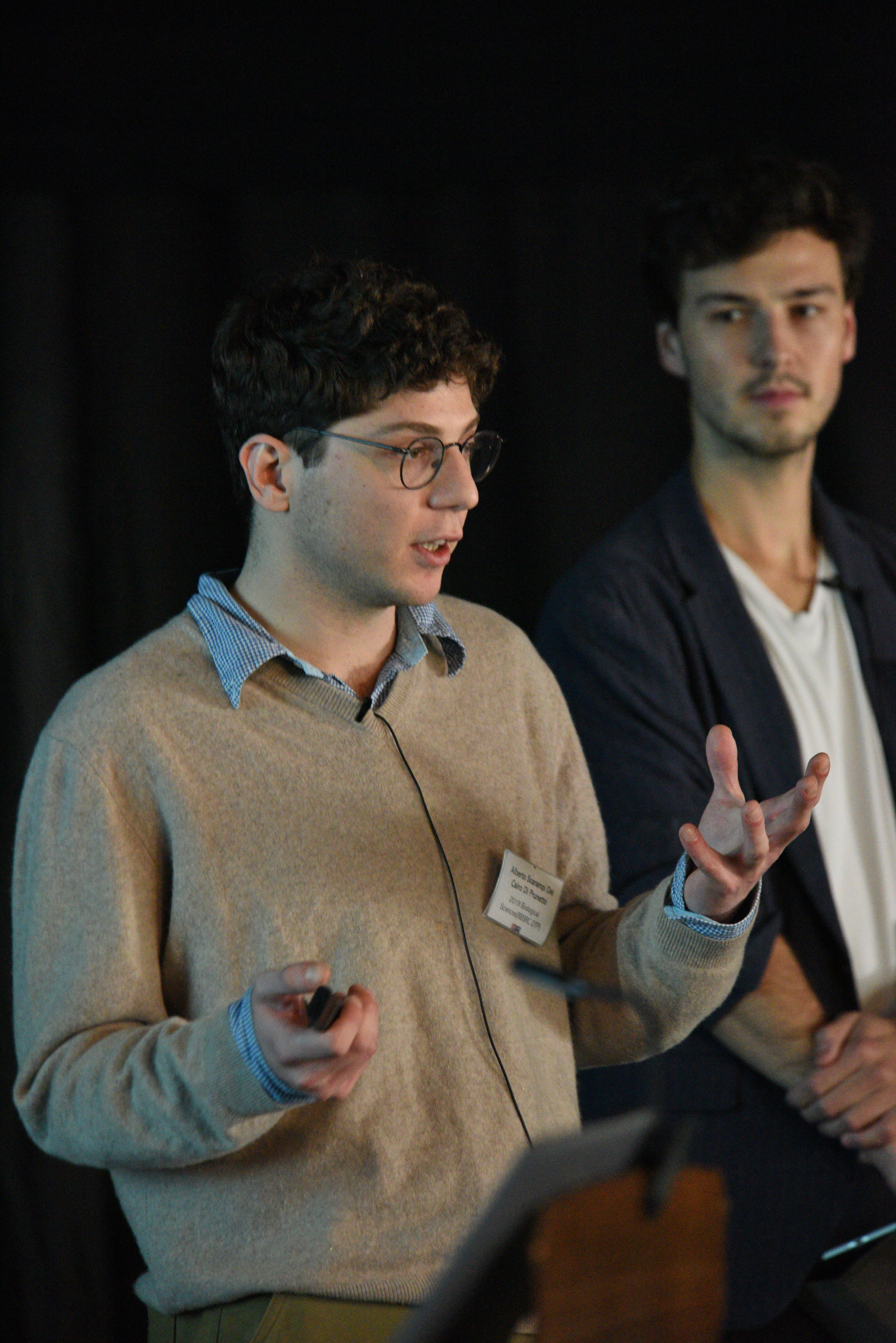 Postgraduate student Alberto Scarampi discussses his research as Darius Kosmützky looks on.